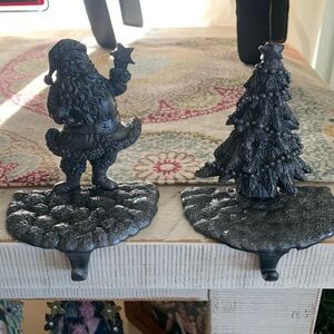 2 metal pewter colored stocking holders, Santa and a Christmastmas tree